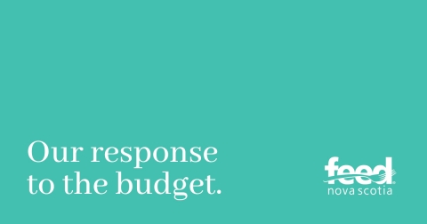 The words our response to the budget appeal on a light green background with Feed Nova Scotia logo