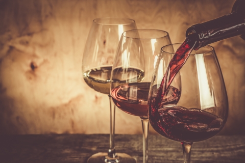 bottle of wine pouring into glass