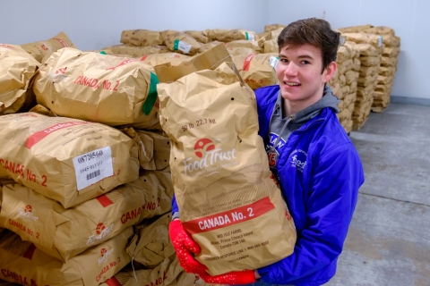 Scott in the warehouse with potatoes