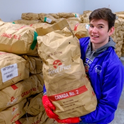 Scott in the warehouse with potatoes