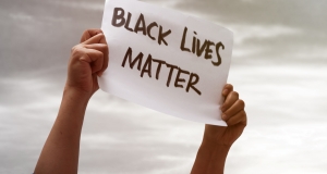 Person holding poster with the words Black Lives Matter
