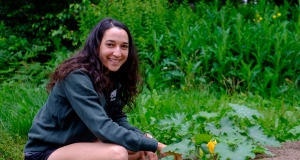 Volunteer kneeling down gardening