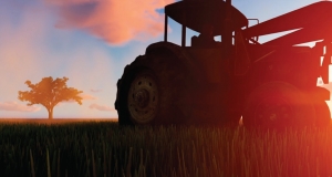 farm tractor in a field at sunrise