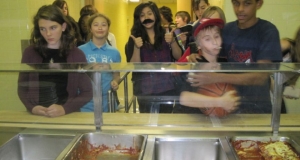 School children lined up at the cafeteria counter