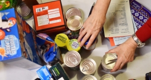 people sorting a food bank order