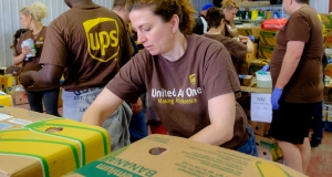 A UPS employee sorts food in the Feed Nova Scotia warehouse